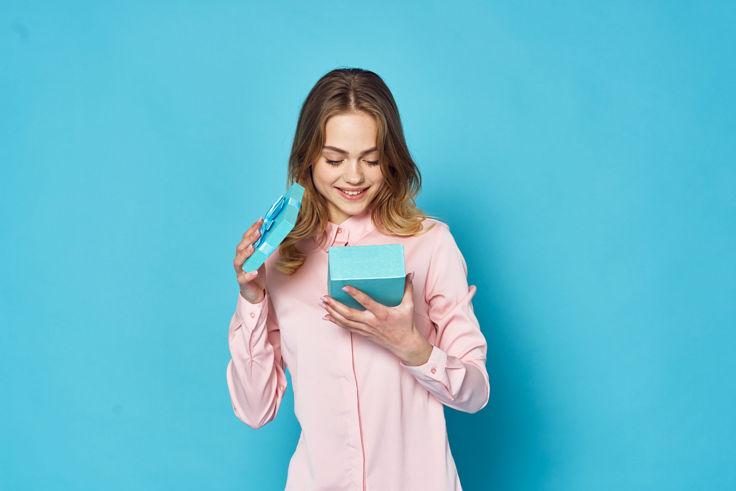 portrait of young woman holding credit card